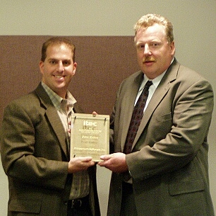 On the right, Peter Collins, CIO, City of Austin is honored as Austin's IT Executive of the Year (Public Sector) by award sponsor Scott Campbell of Momentum Software